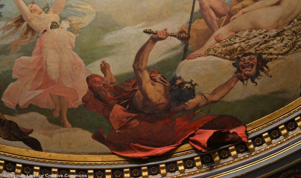Plafond du théâtre Graslin de Nantes par Hippolyte Berteaux. Détail : le dieu grec Momos du sarcasme et de la moquerie avec le tissu rouge réel de sa cape si intrigant pour le spectateur qui lève les yeux. Plafond du théâtre Graslin de Nantes par Hippolyte Berteaux. Détail : le dieu grec Momos du sarcasme et de la moquerie avec le tissu rouge réel de sa cape si intrigant pour le spectateur qui lève les yeux.